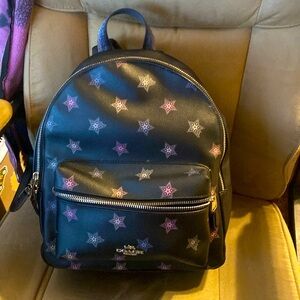 Coach black with stars backpack